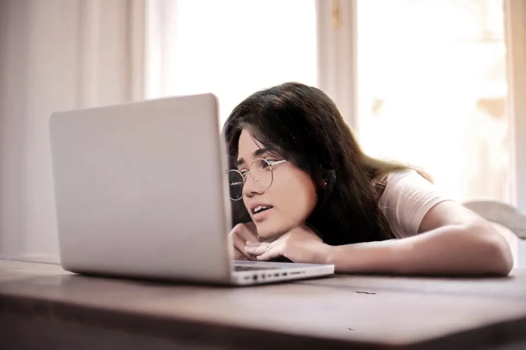 aayushma paudel looking at laptop screen